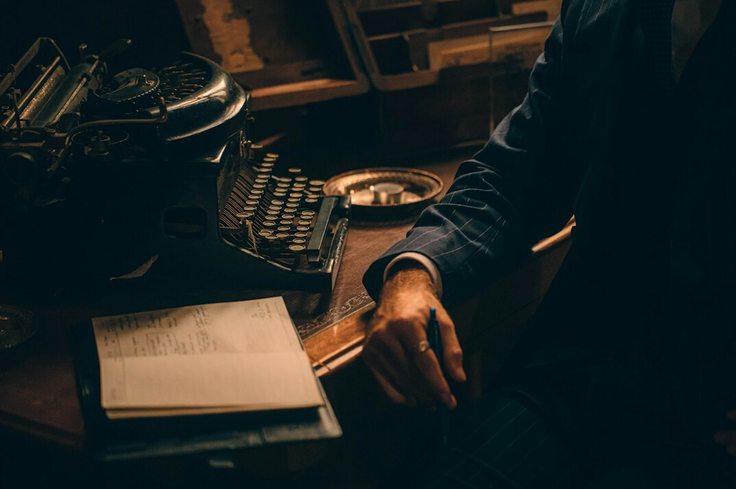 detective reading old notebook